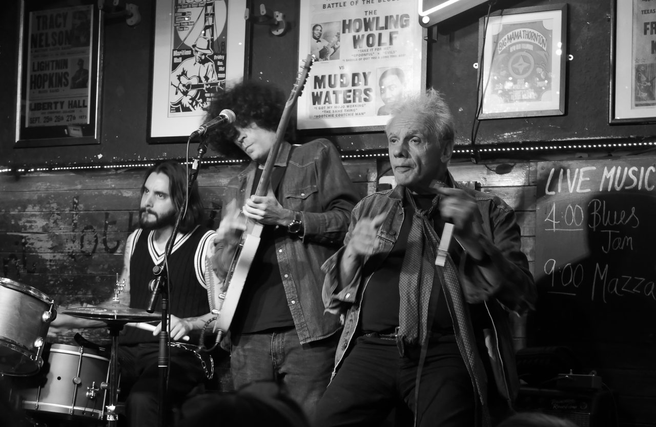 Blues Jam. The band in full flow under the old posters.